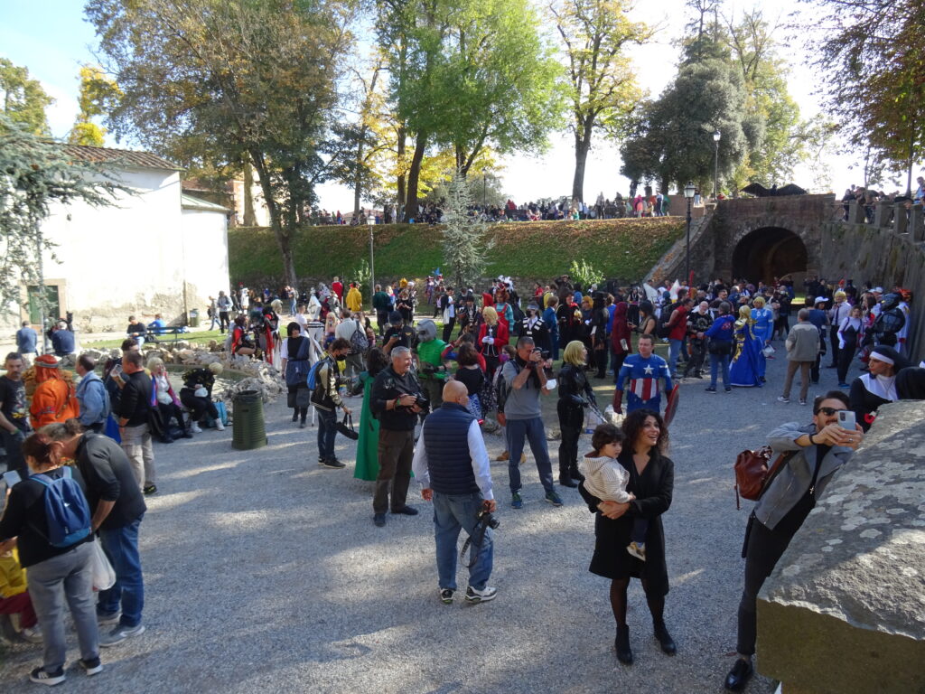 A crowd of visitors and cosplayers at the foot of the walls of Lucca during Lucca Comics & Games